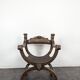 Curule chair Dagobert in carved walnut with lion heads.