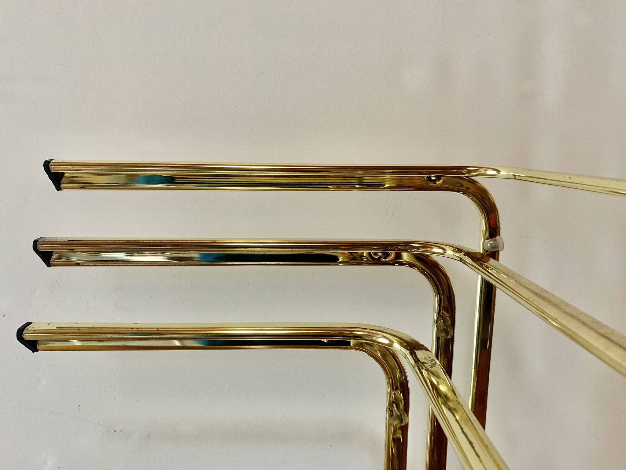 Vintage nesting tables in gold metal and smoked glass