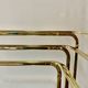 Vintage nesting tables in gold metal and smoked glass