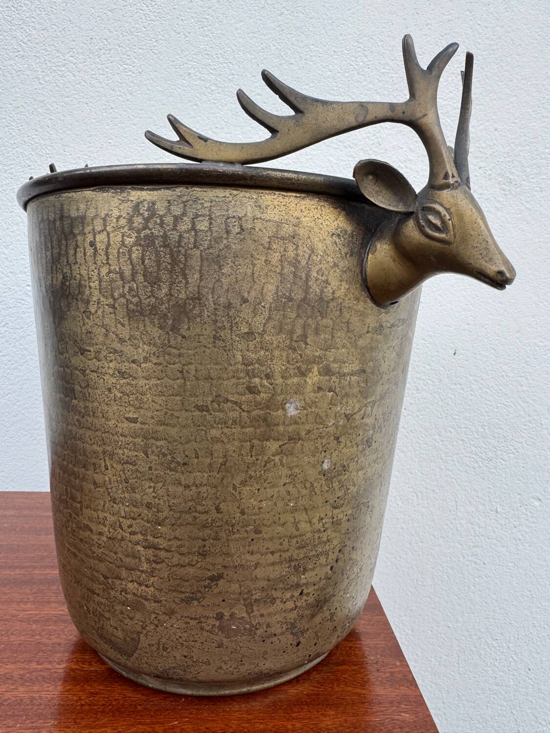 Antique champagne cooler with stag heads