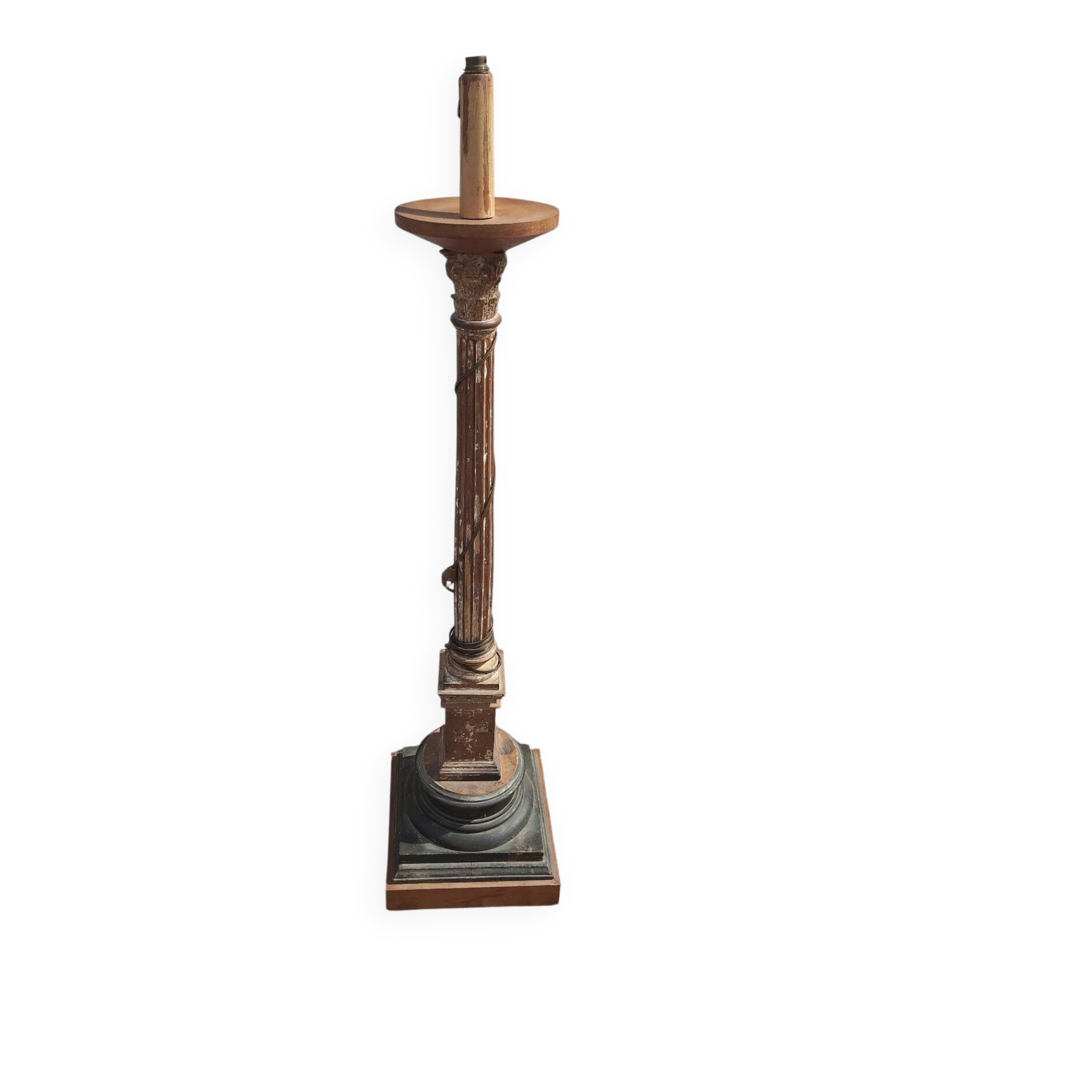 Large antique church candlestick in carved wood transformed into a lamp.
