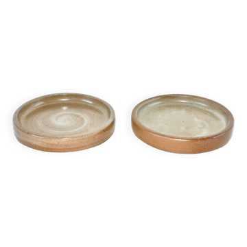 Pair of enamelled stoneware bottle coasters 1970