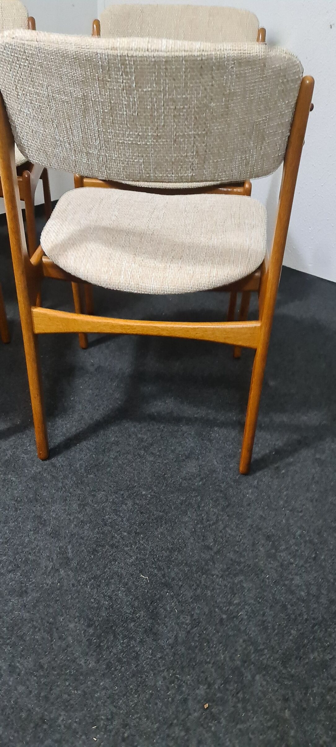 A set of four vintage teak dining chairs