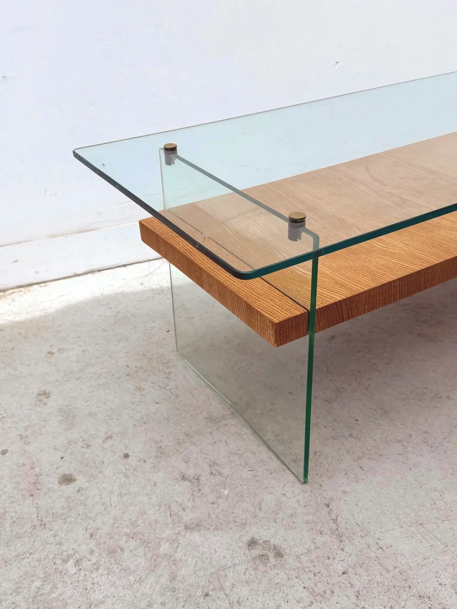Coffee table by Robert Debiève in ash veneer, glass and brass, France 1950.