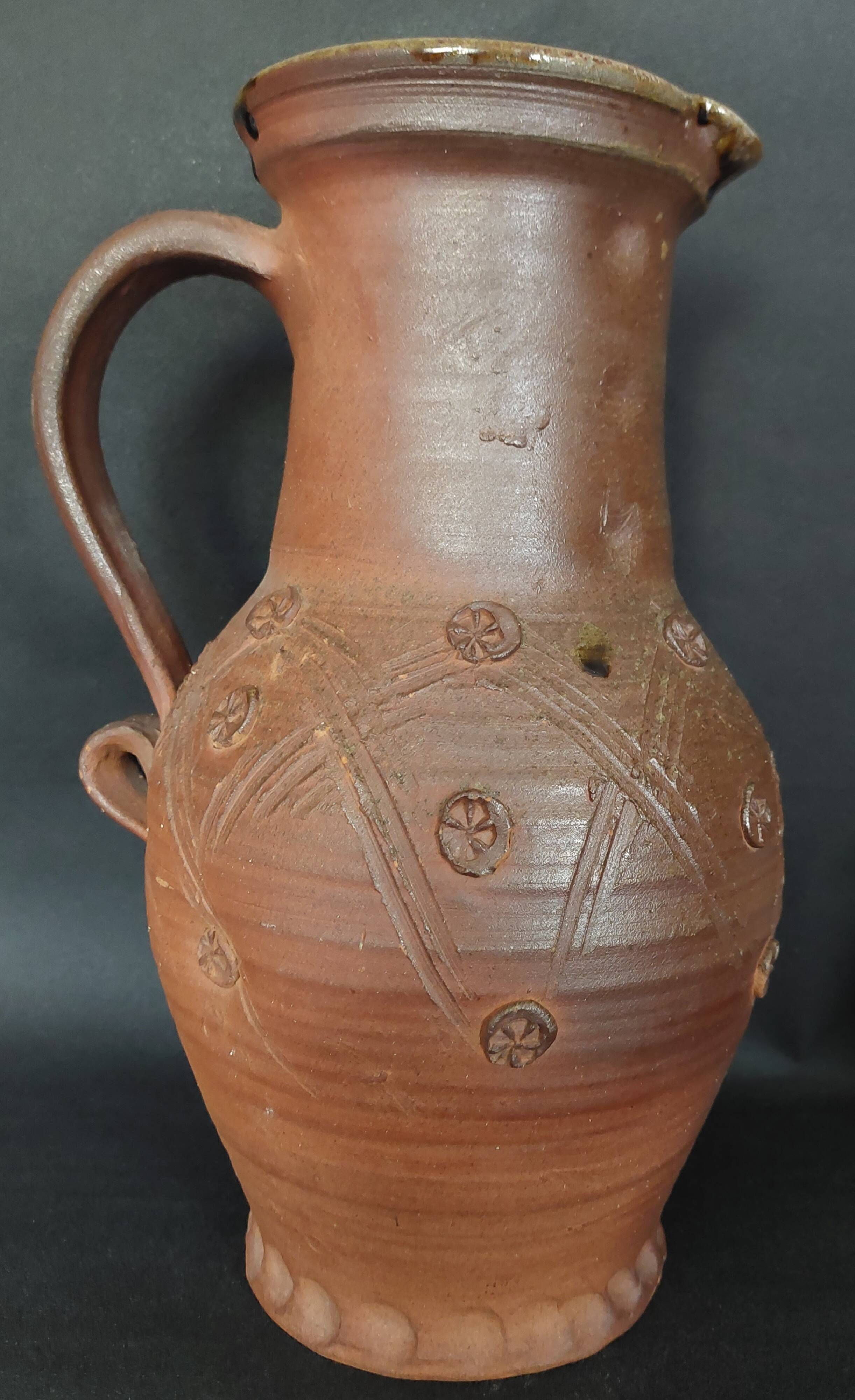 Vintage pitcher with a signature to identify.