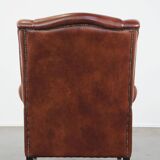 Cognac-colored cowhide wingback chair