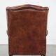 Cognac-colored cowhide wingback chair