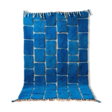 Handmade traditional pure wool carpet with blue patterns.