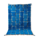 Handmade traditional pure wool carpet with blue patterns.