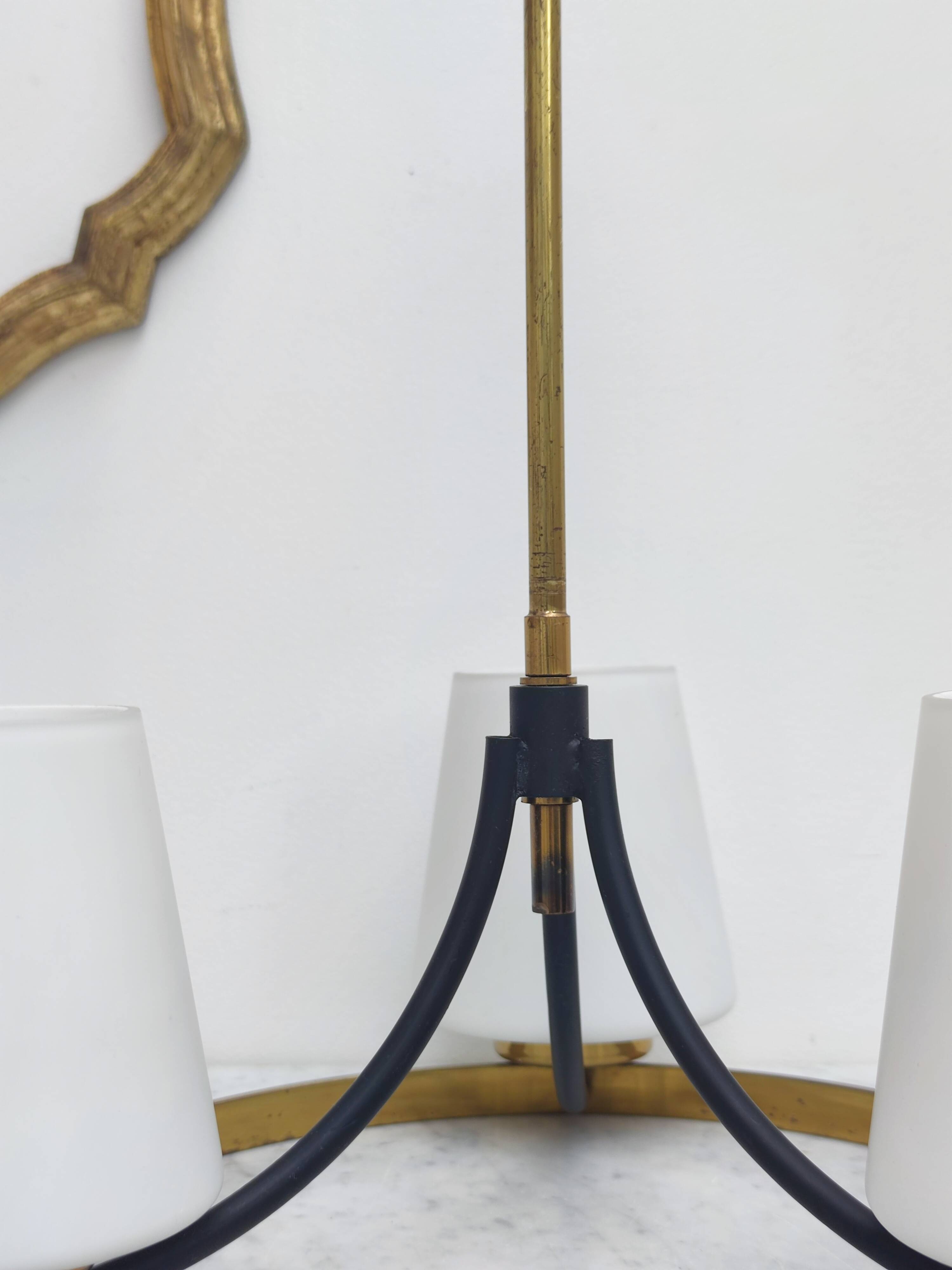 Brass chandelier and white opalines