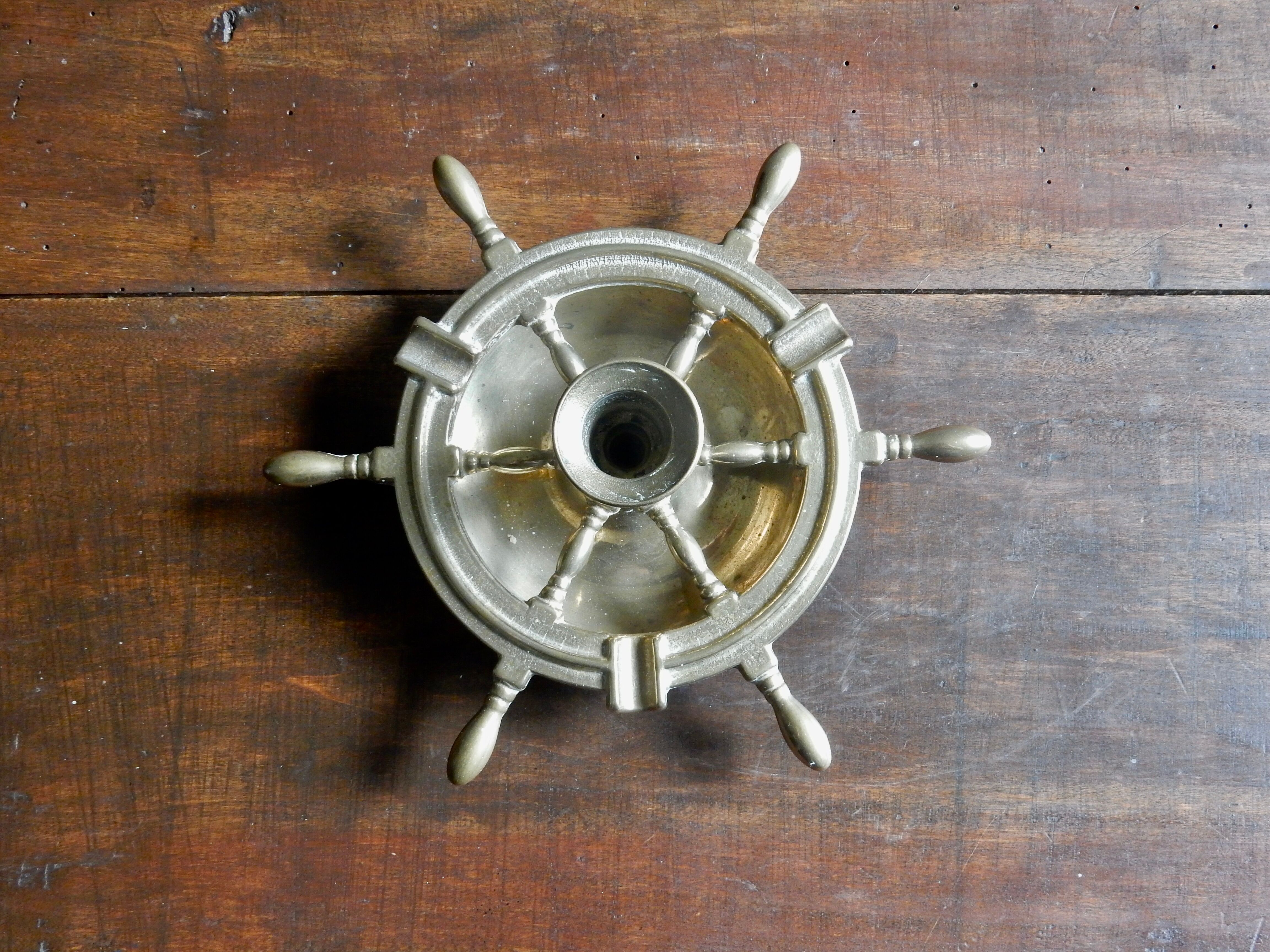 Brass ashtray and candlestick shaped boat bar