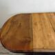 Oval wooden table with extensions
