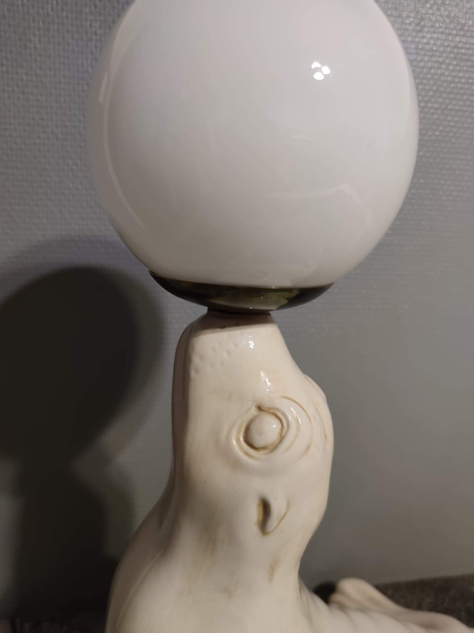 White ceramic sea lion lamp and opaline globe