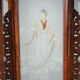 Asian wooden lantern carved with dragons and painted glass panels