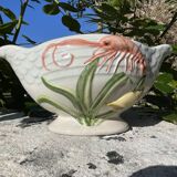 Sauce boat with shellfish decorations