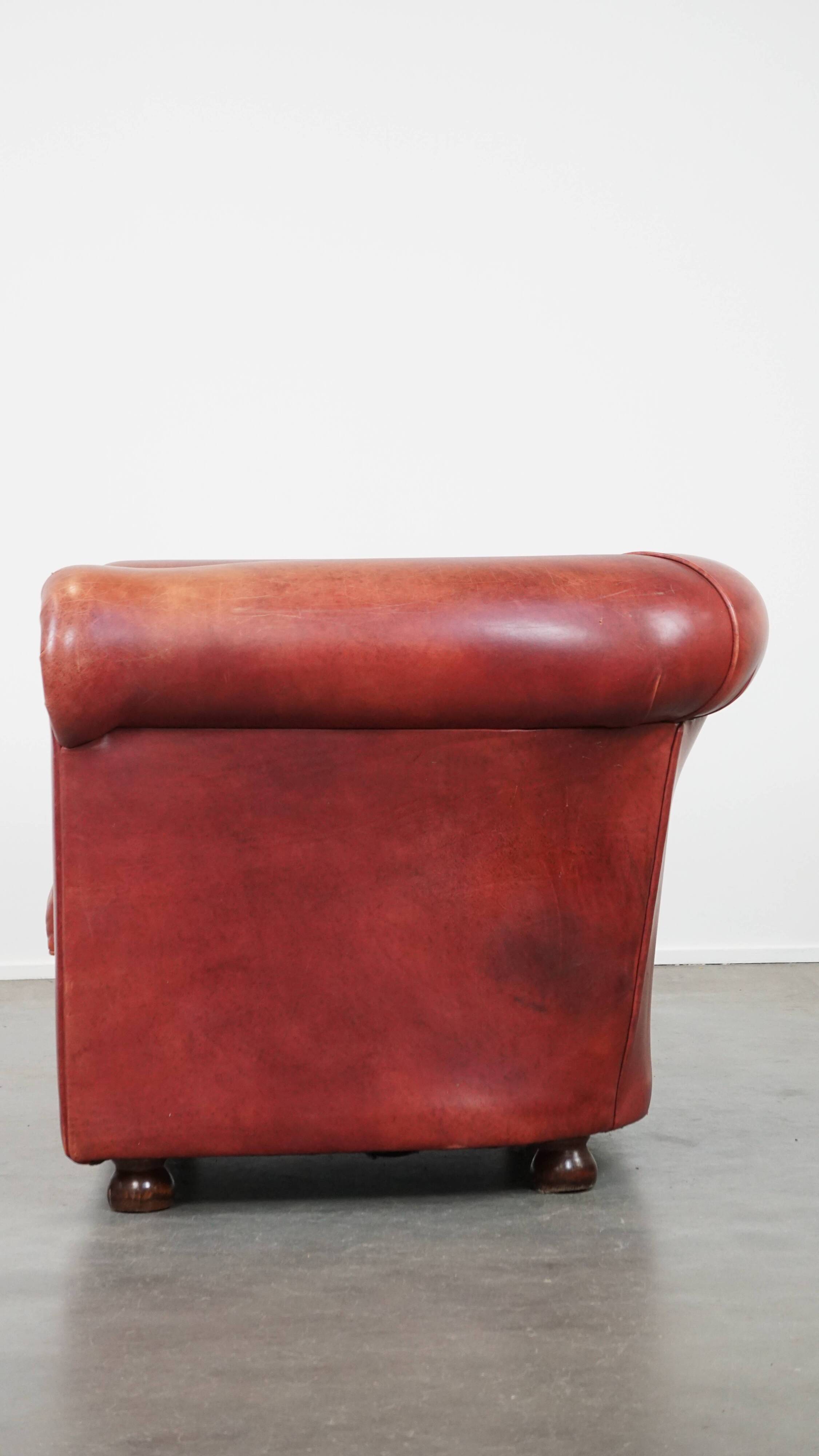English Chesterfield club chair in light red cowhide leather