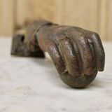 Antique cast iron door knocker in the shape of a 19th century hand
