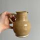 Hand-thrown ceramic pitcher