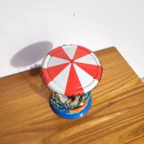 Old tin carousel toy