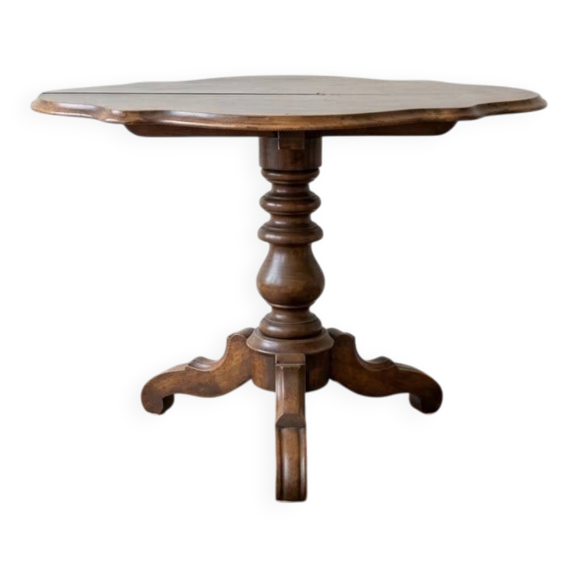 Antique wooden gueridon with a scalloped top.