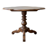 Antique wooden gueridon with a scalloped top.