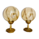 2 bedside lamps with round amber glass globes and gold metal.