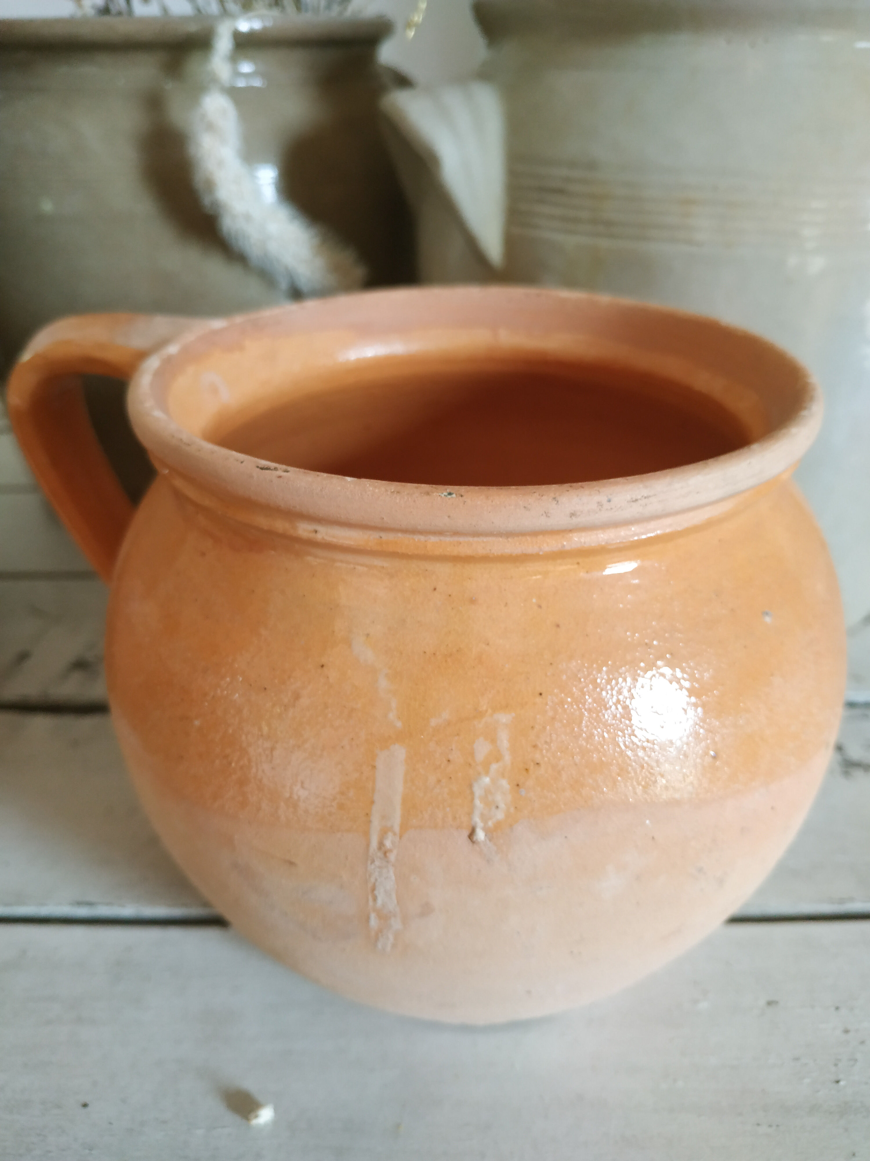 Old terracotta pot glazed ochre color