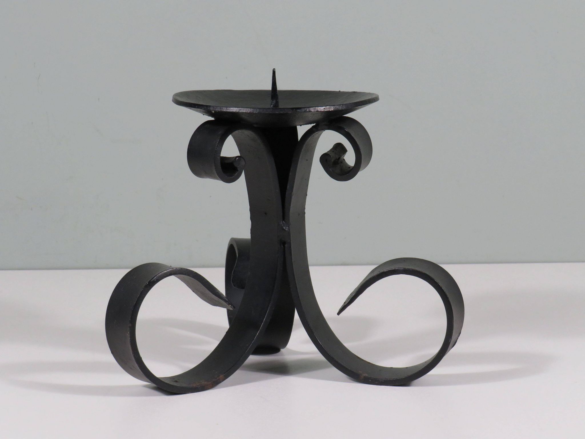 Vintage wrought iron chandelier for large candle.