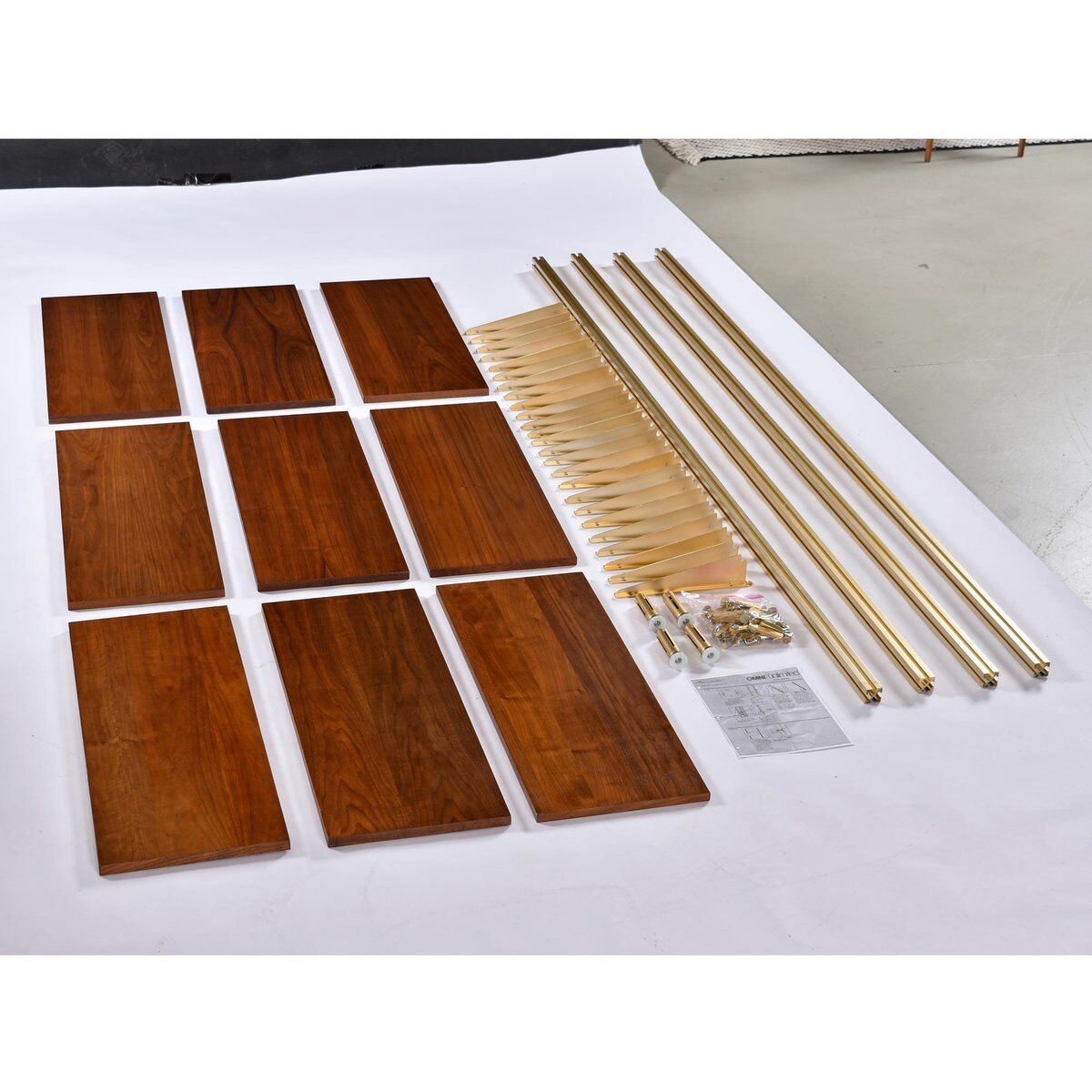 Tension pole free standing rose gold aluminum Omni wall unit by George Nelson