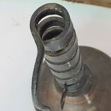 Candle holder with iron and wood pusher
