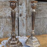Pair of chiseled metal candle holders