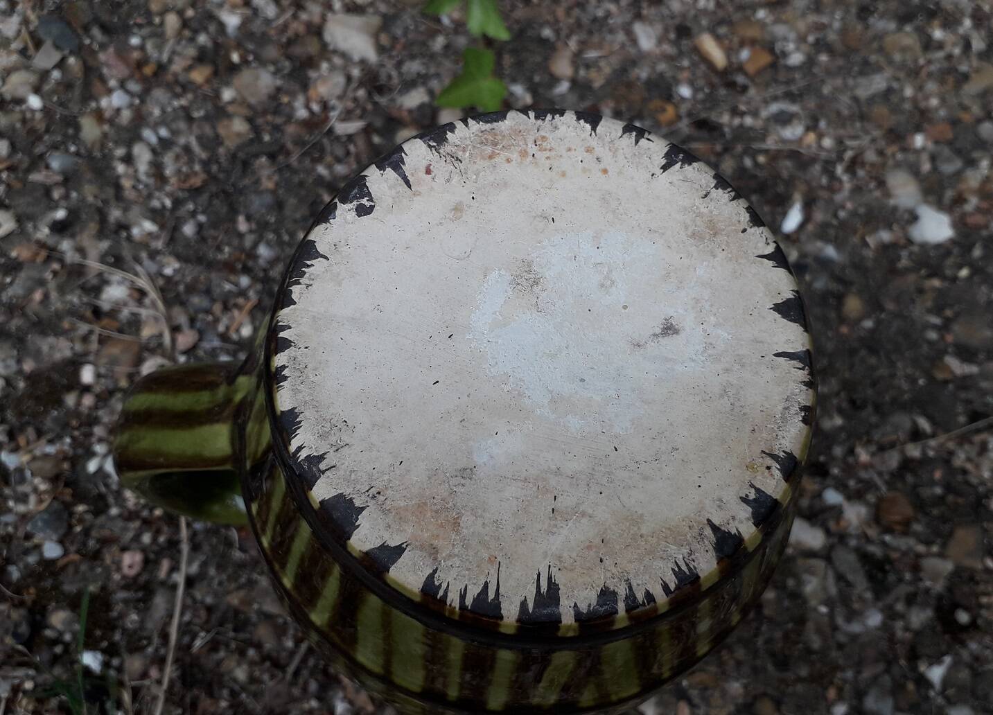 Green and brown ceramic jug