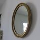 Old oval mirror in gilded wood 50s 60s