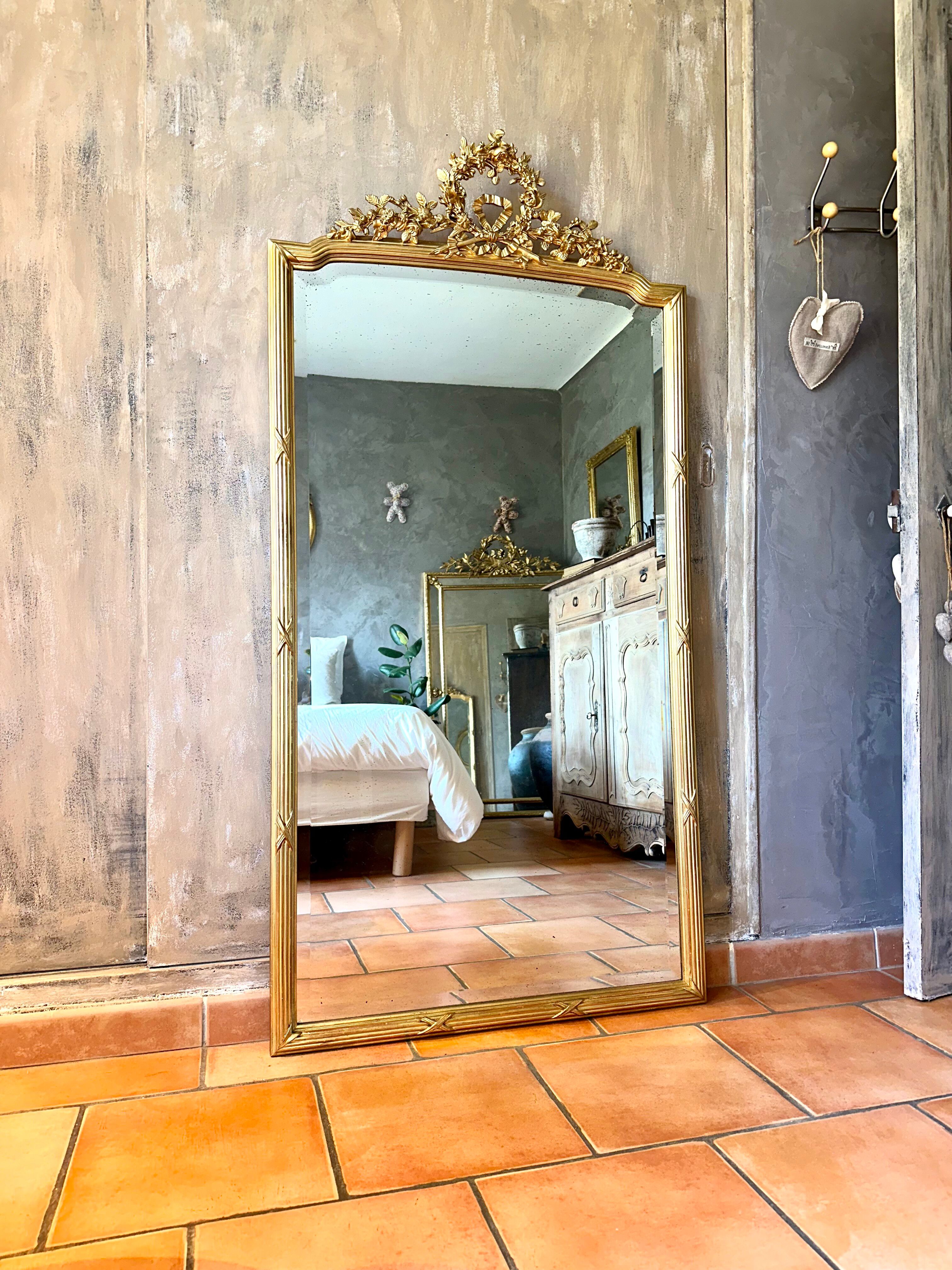 Antique mirror with a gilded pediment Louis XVI