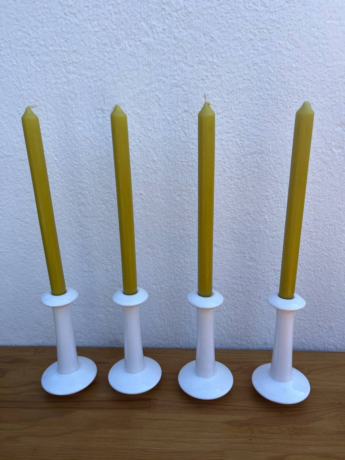 Set of 4 white ceramic candle holders