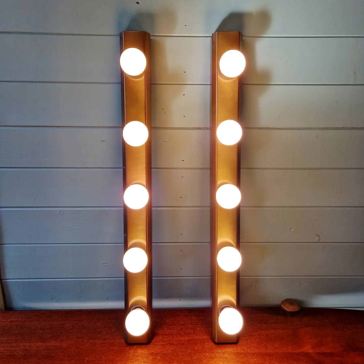 Set of three wall sconces in solid brass, 1970s-80s.