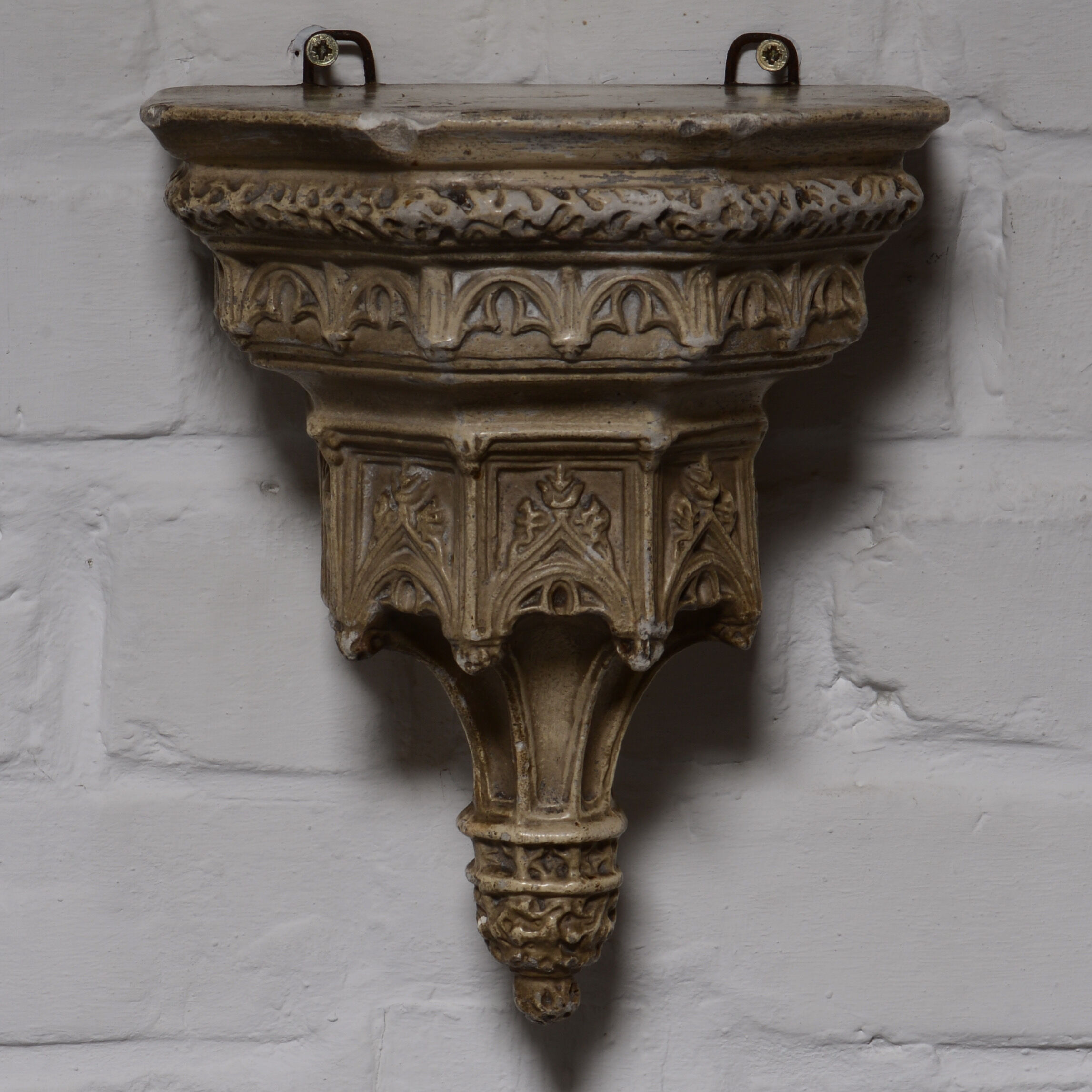 Gothic-style plaster wall console