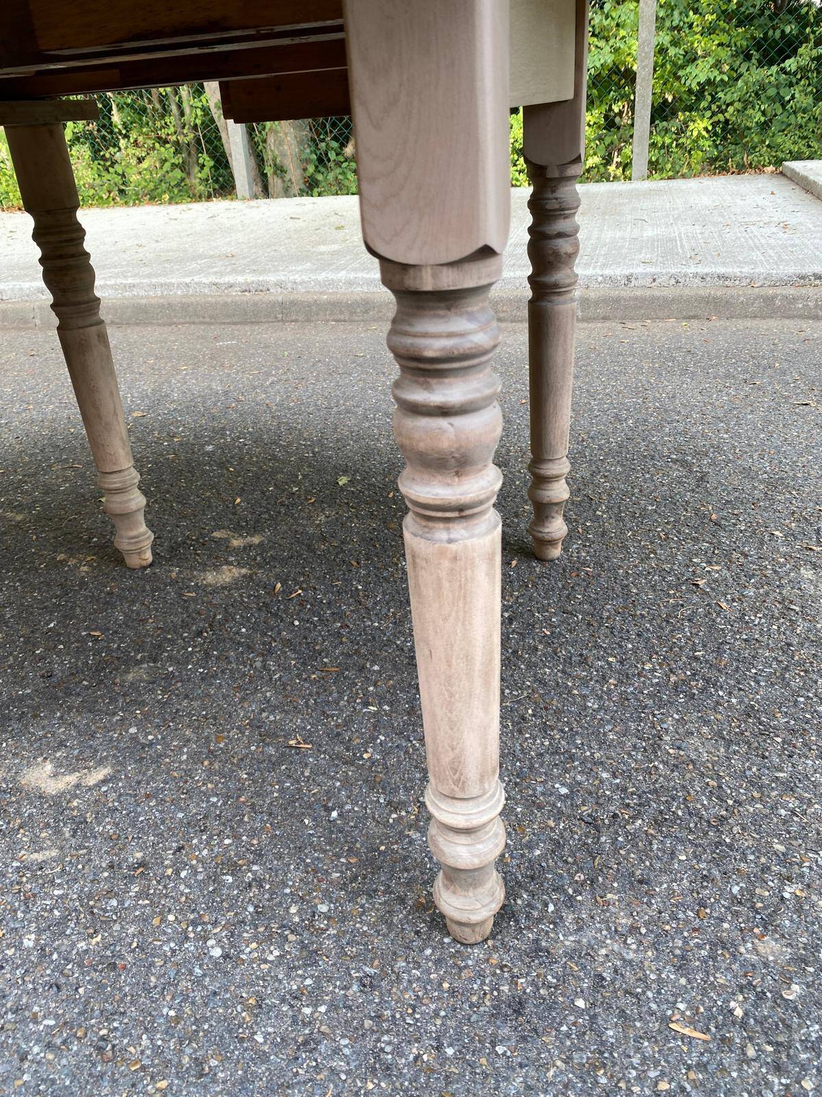 Round extendable dining table with flaps, stripped in raw oak, with 3 extensions.