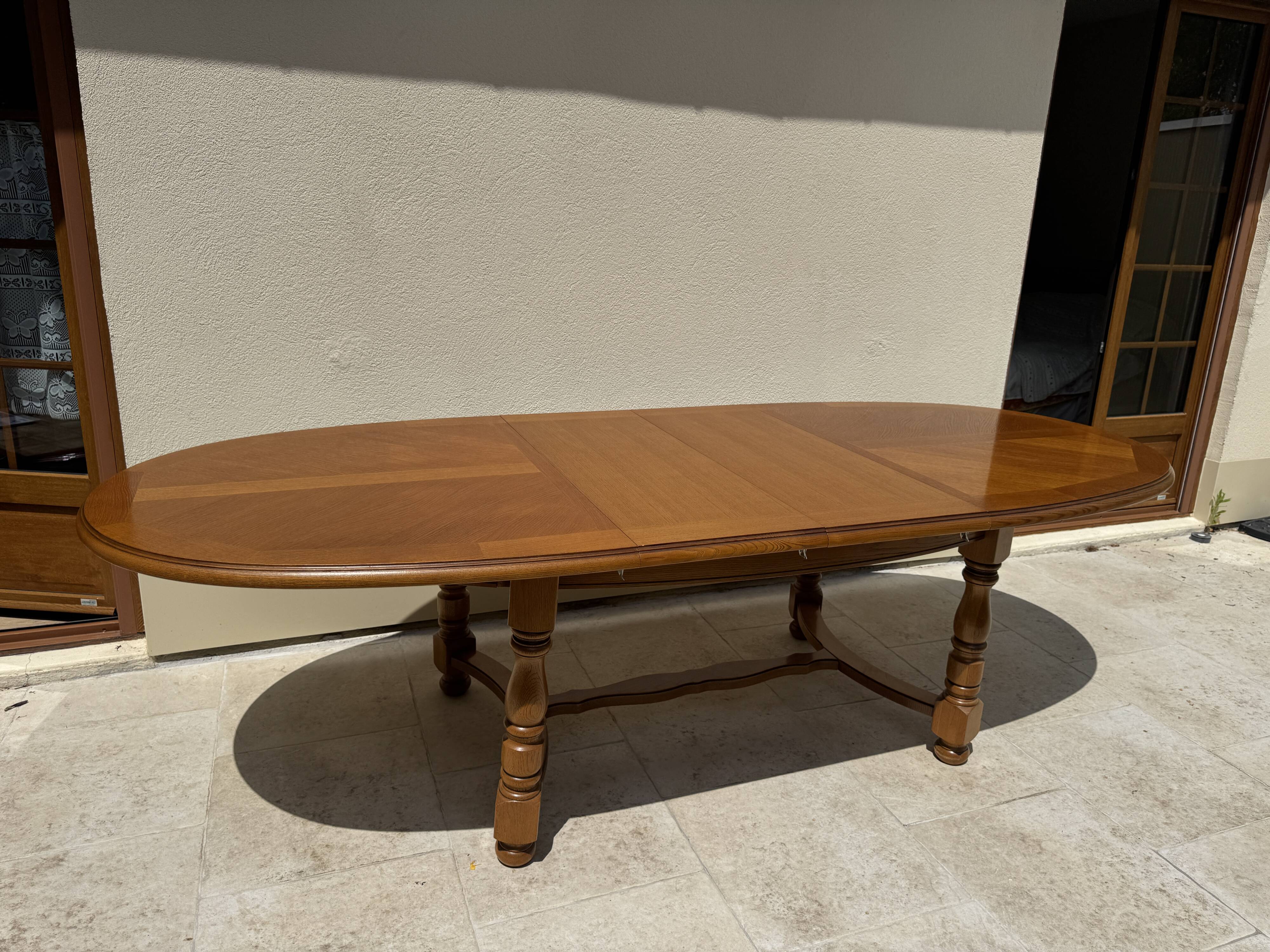 Oak dining table, oval living room table with two extensions.