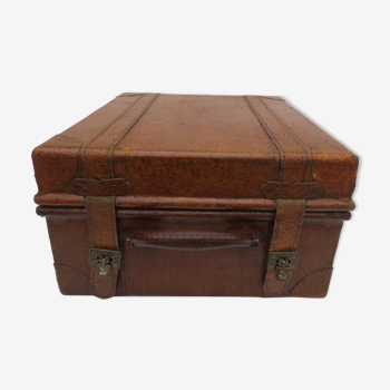Rectangular wooden suitcase covered with leather