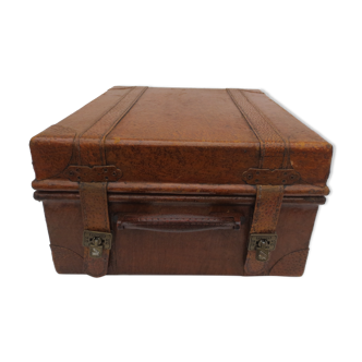 Rectangular wooden suitcase covered with leather
