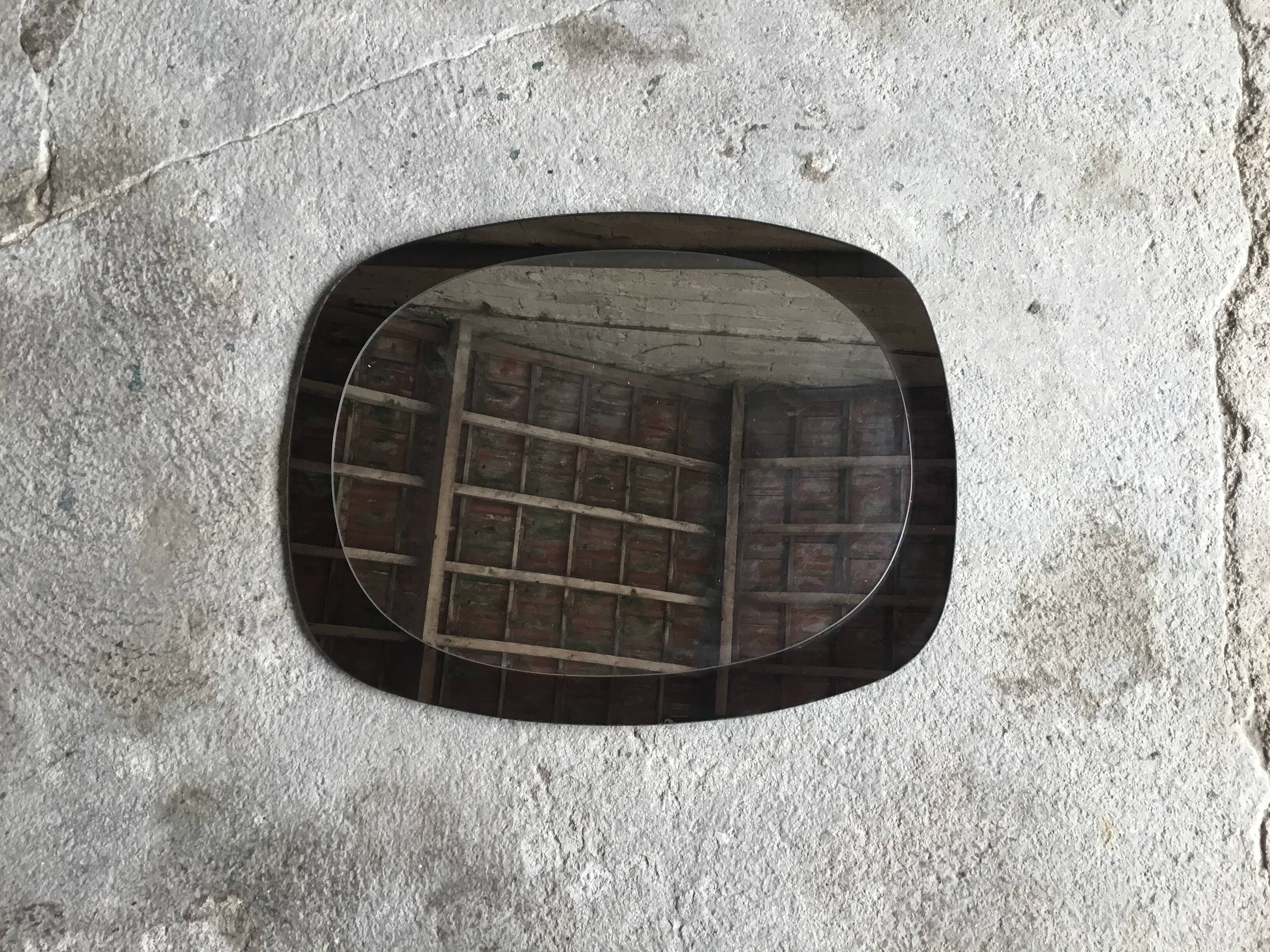 Space Age wall mirror ovoid smoked glass - design 1970