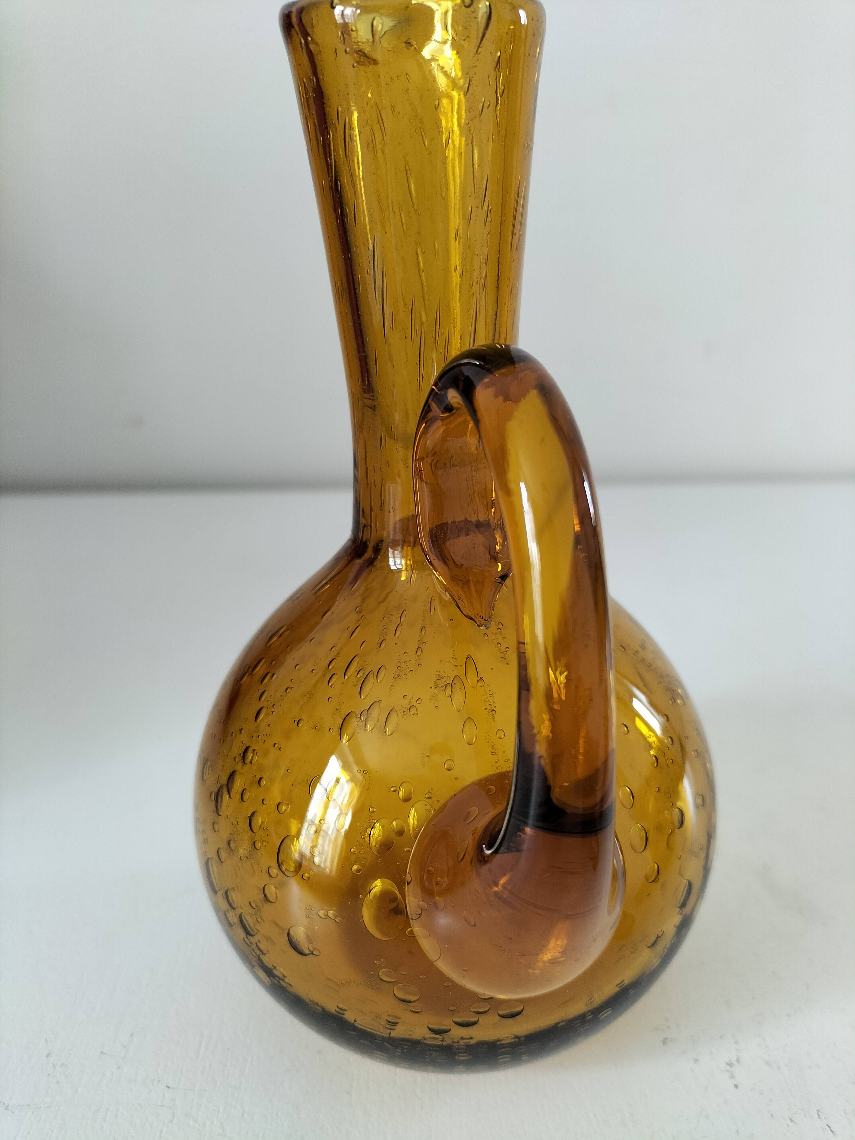 Duo of blown glass carafes – Biot signed – Bubbled amber glass