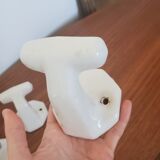 Trio of white porcelain hooks