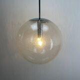 Large suspended lamp with a glass globe featuring bubbles by Peill & Putzler 1970.