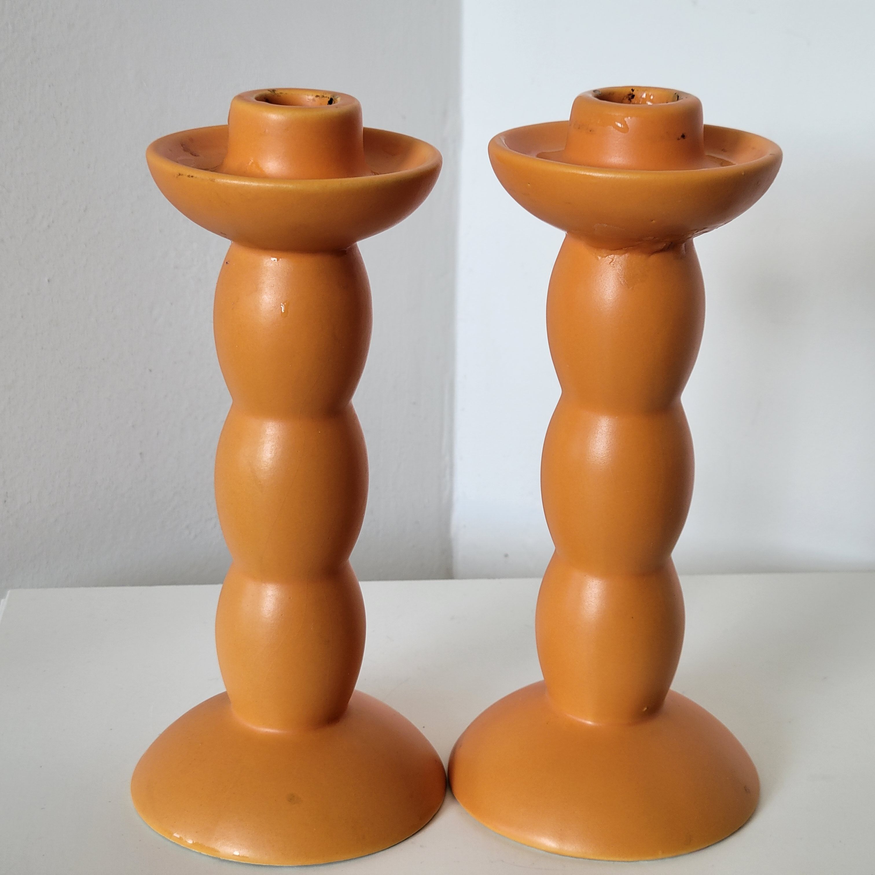 2 orange ceramic candle holders