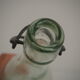 Bottle with mechanical closure in white glass