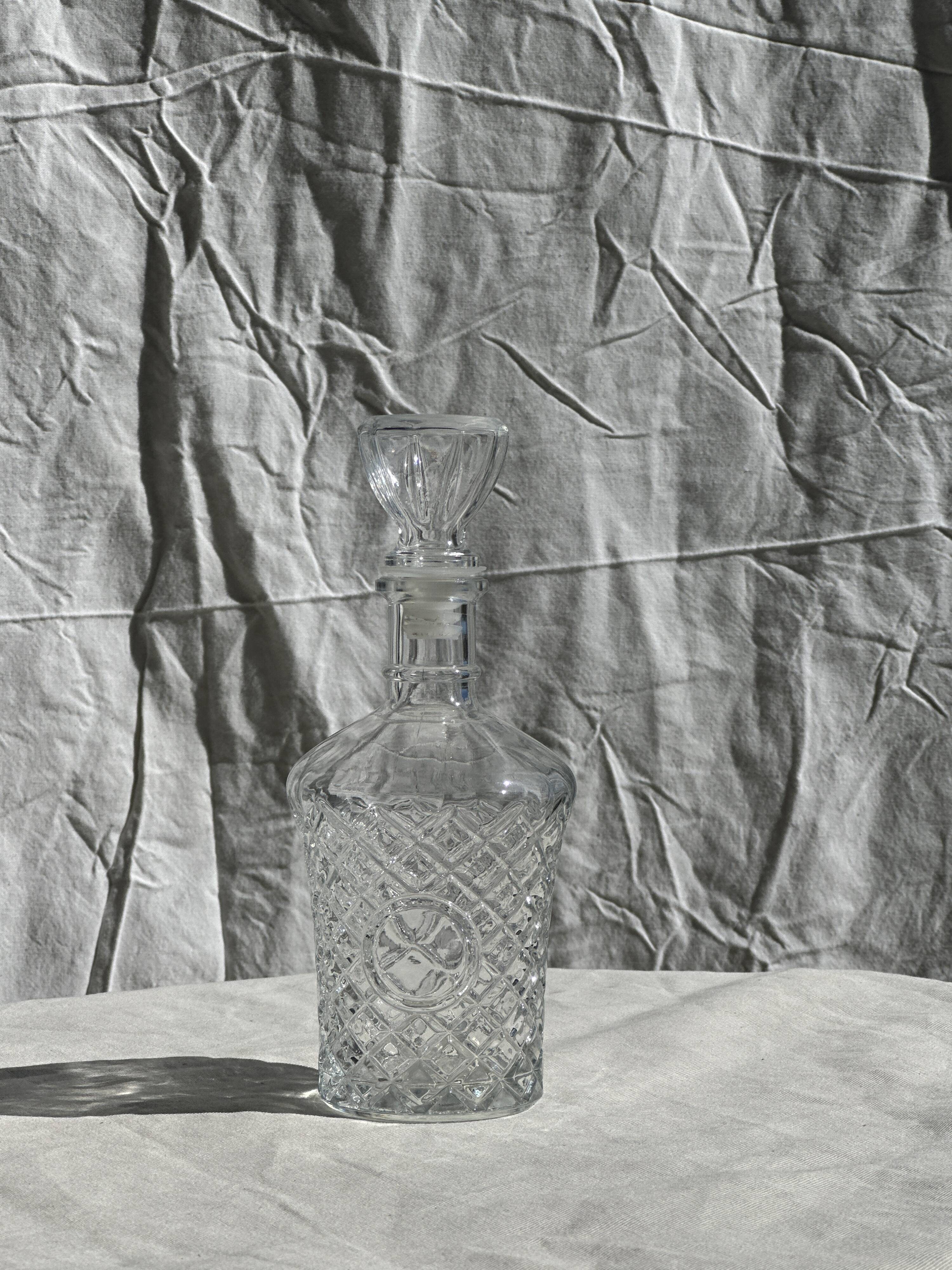 Small cylindrical glass whiskey decanter H:23