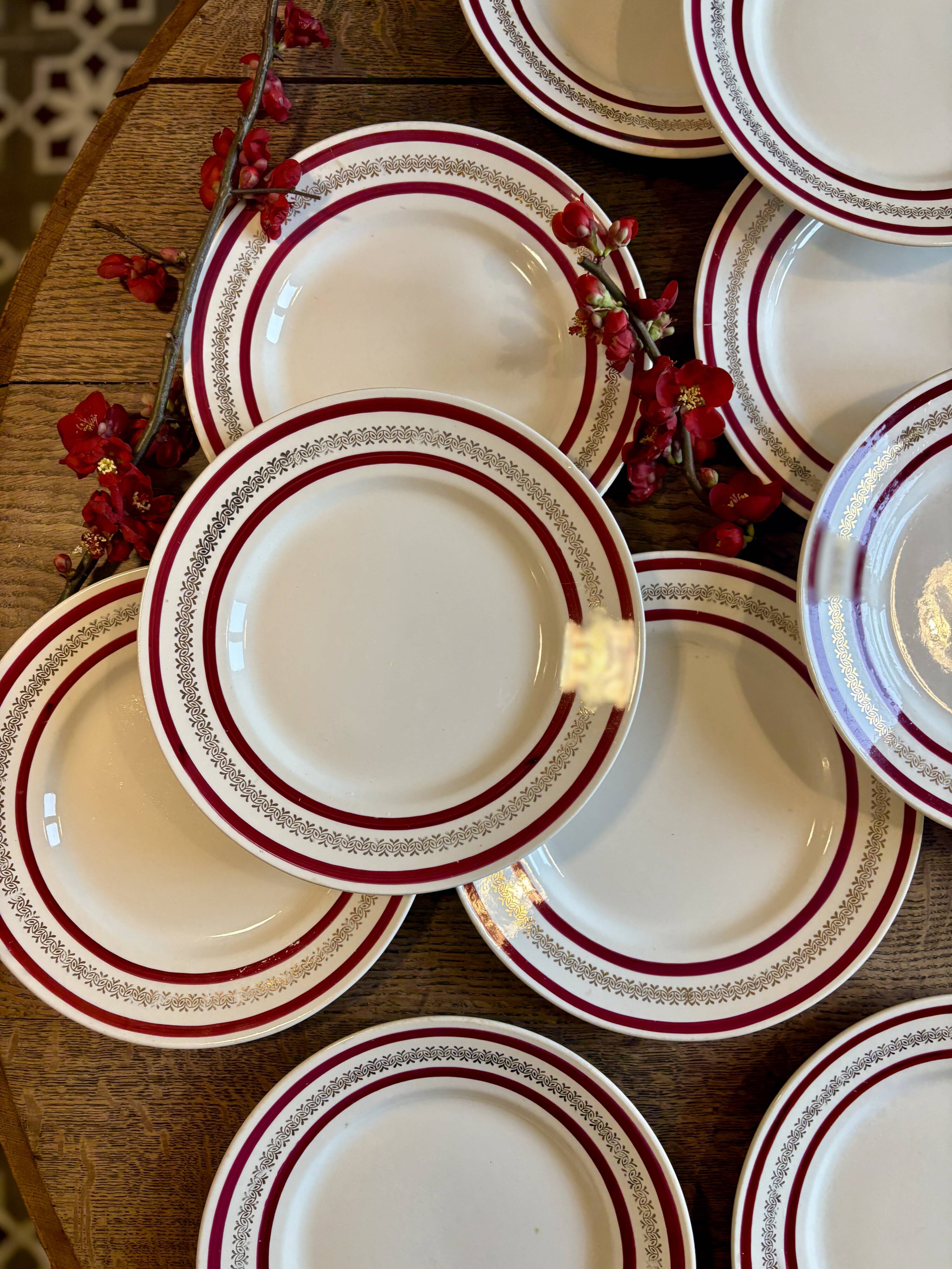 Set of 12 antique Gien red and gold dinner plates.