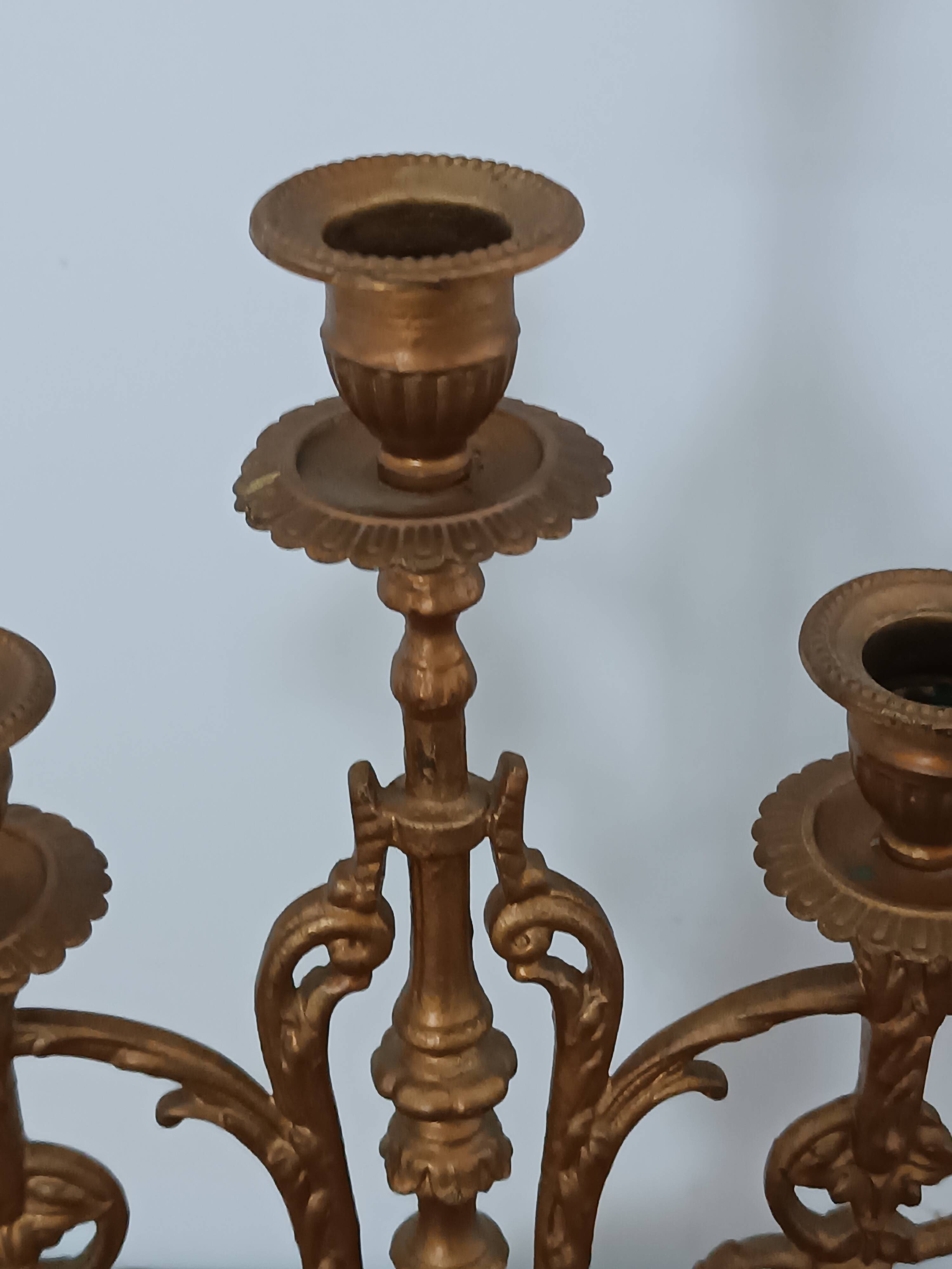 Bronze candlestick with lion head decoration